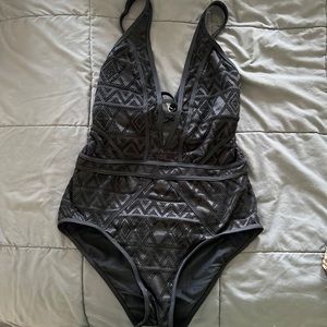 Crochet one piece bathing suit.